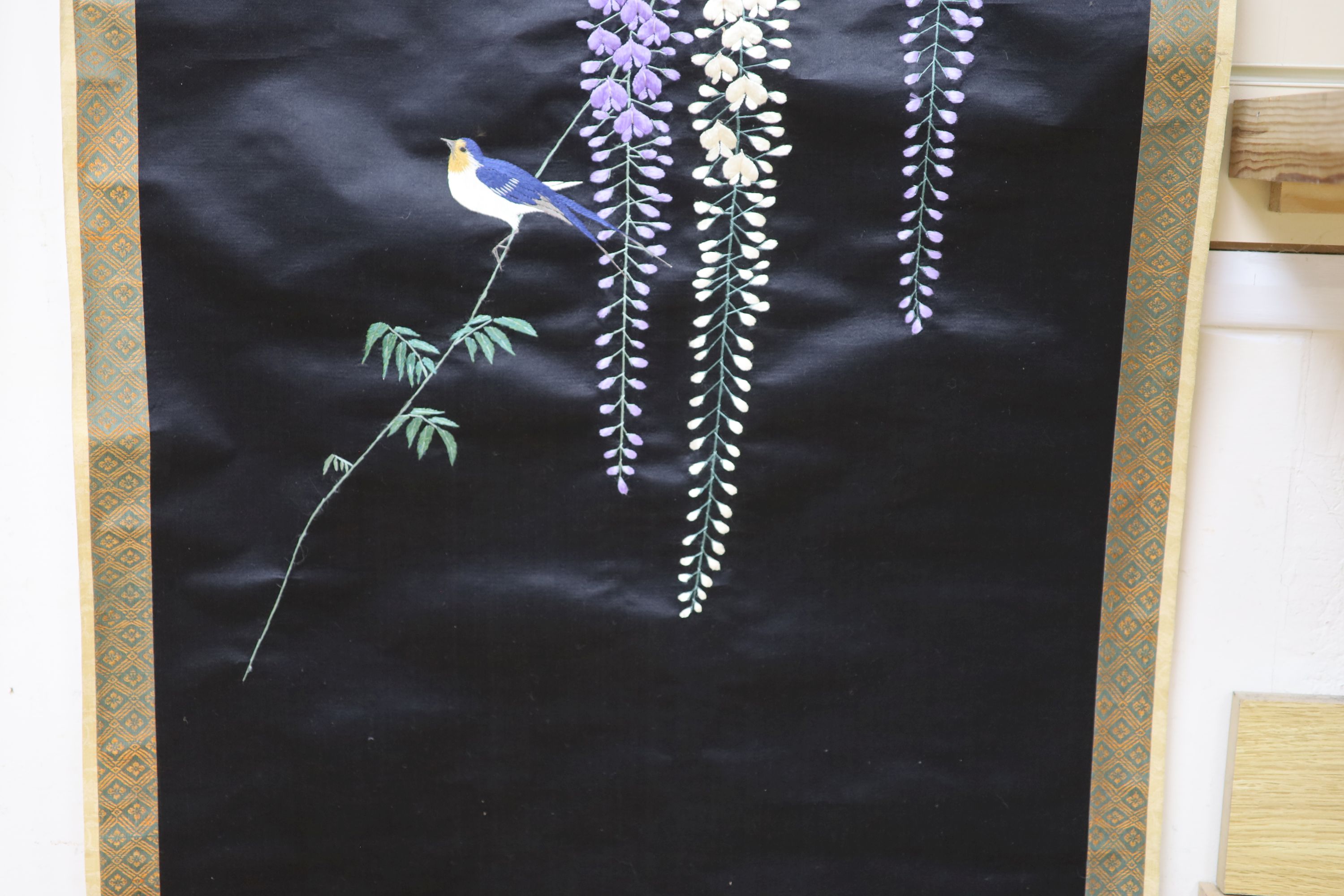 A Japanese embroidered wisteria hanging scroll, overall length 170cm